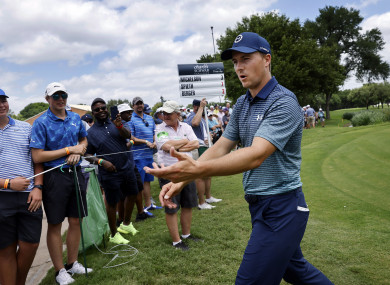 Jordan Spieth reacts to fans after he finished round one in the Charles Schwab Challenge at the Colonial Country Club in Fort Worth.