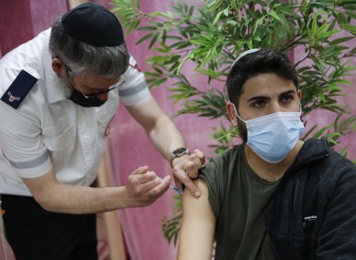 An Israeli man receives a dose of Covid-19 vaccine in a clinic in the central Israeli town of Kfar Chabad.