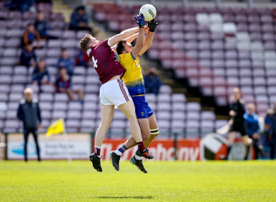 Galway's Jack Glynn with Donie Smith of Roscommon.