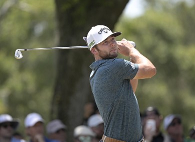 Sam Burns watches his tee shot on the second hole during the final round.
