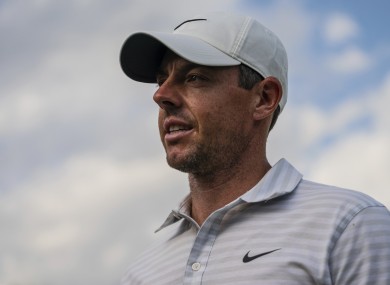 Rory McIlroy walks off after finishing on the 18th hole.