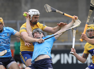Donal Burke is tackled by Conor Cleary.