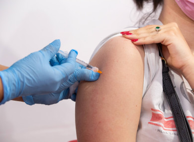 A student gets the Pfizer vaccine inside the vaccination hub in the Porta di Roma shopping centre in Rome yesterday.