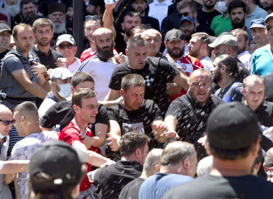 Opponents of the march shout as they block off the capital's main avenue to an LGBT march in Tbilisi, Georgia,