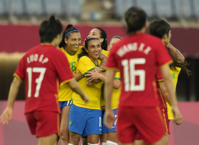 Marta celebrates scoring today.