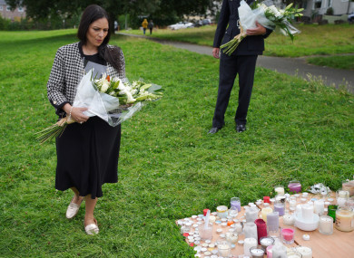 Home Secretary Priti Patel lays a bouquet of flowers in Plymouth, Devon.