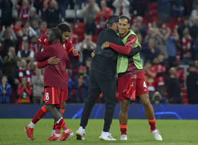 Virgil van Dijk (right) and Jurgen Klopp hug at the final whistle of Wednesday's Champions League win.