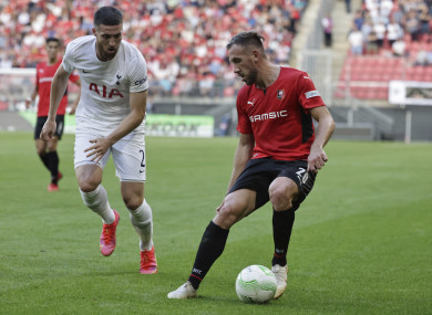 Rennes goalscorer Flavien Tait, right, challenges Matt Doherty for possession.