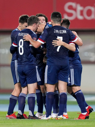 Scotland players celebrate after Lyndon Dykes goal.