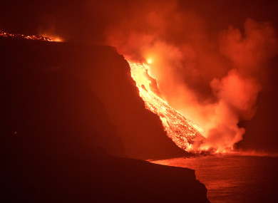 Lava from a volcano reaches the sea on the Canary island of La Palma, Spain in the early hours of this morning.