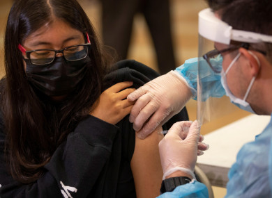 Student Stacy Rubio, a Junior at Woodrow Wilson Senior High School, receives a coronavirus vaccine