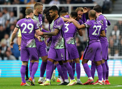Spurs players celebrate.