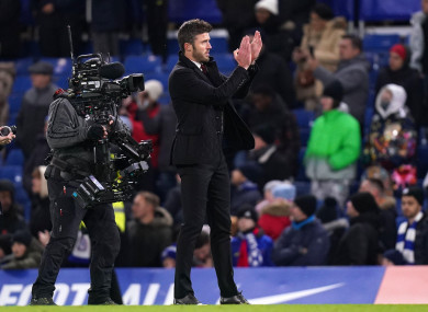 Manchester United caretaker manager Michael Carrick applauds the fans.