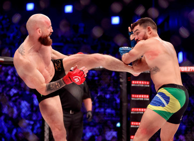 Patricky Pitbull, right, stopped Queally in the second round to become Bellator lightweight world champion.