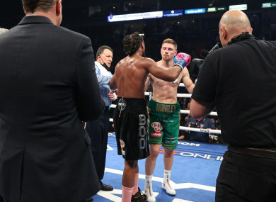 Demetrius Andrade consoles Jason Quigley after defending his title against the Donegal man.