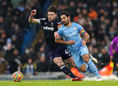 West Ham's Declan Rice tangles with Manchester City's Ilkay Gundogan.