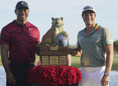 Viktor Hovland pictured with Tiger Woods after winning the Hero World Challenge.