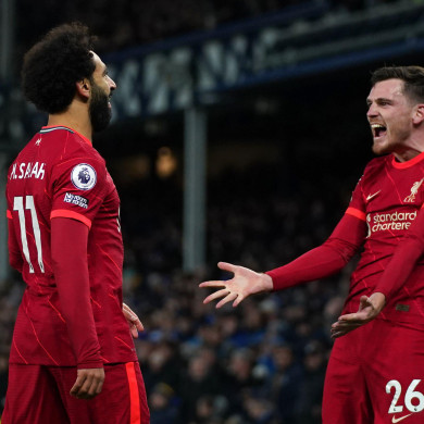 Liverpool's Mohamed Salah (left) celebrates with Andrew Robertson