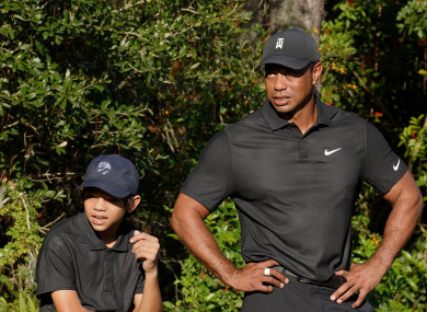 Woods pictured with his son, Charlie, at the event.