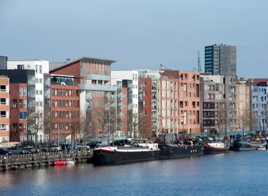Modern apartment buildings by the canal in Amsterdam