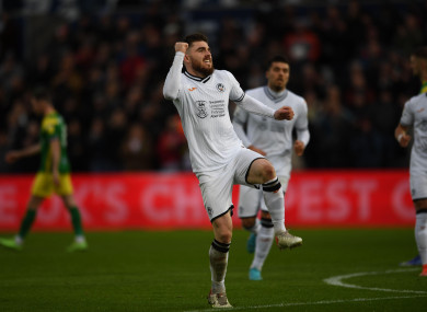 Ryan Manning (r) of Swansea City celebrates after scoring.
