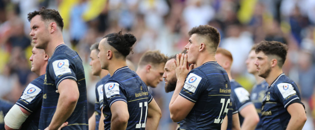 Leinster players watch on as La Rochelle celebrate an historic win.