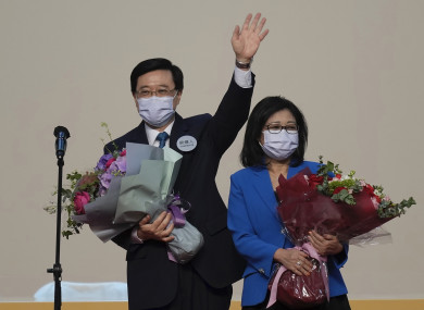 John Lee celebrates with his wife after declaring his victory in the chief executive election of Hong Kong.