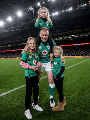 Keith Earls celebrates after last November's New Zealand game with his daughters Ella May, Emie and Laurie.