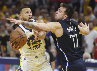Steph Curry shoots against Luka Doncic.