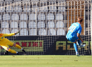 Italy's Nicolo Rovella scores their first goal from the penalty spot past Ireland goalkeeper Brian Maher.