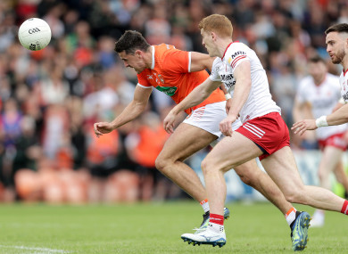 Armagh's Stefan Campbell and Peter Harte of Tyrone.