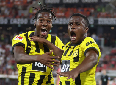 Dortmund's Youssoufa Moukoko celebrates with Jamie Bynoe-Gittens (left).