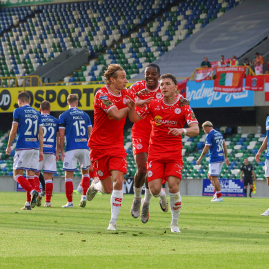 Ali Coote (right) celebrates with Harry Wood and Mipo Odubeko.