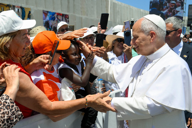 Pope condemns 'indifference' to migrants as he honours thous
